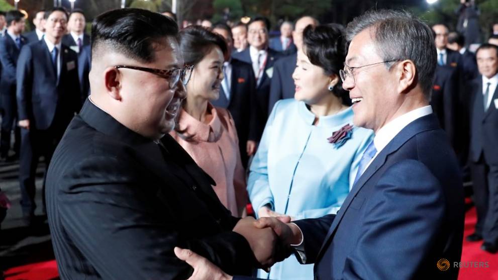 south-korean-president-moon-jae-in--north-korean-leader-kim-jong-un--kim-s-wife-ri-sol-ju-and-moon-s-wife-kim-jung-sook-attend-a-farewell-ceremony-at-the-truce-village-of-panmunjom-1.jpg