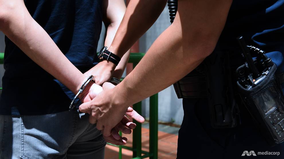 singapore-police-arresting-handcuffs-2.jpg