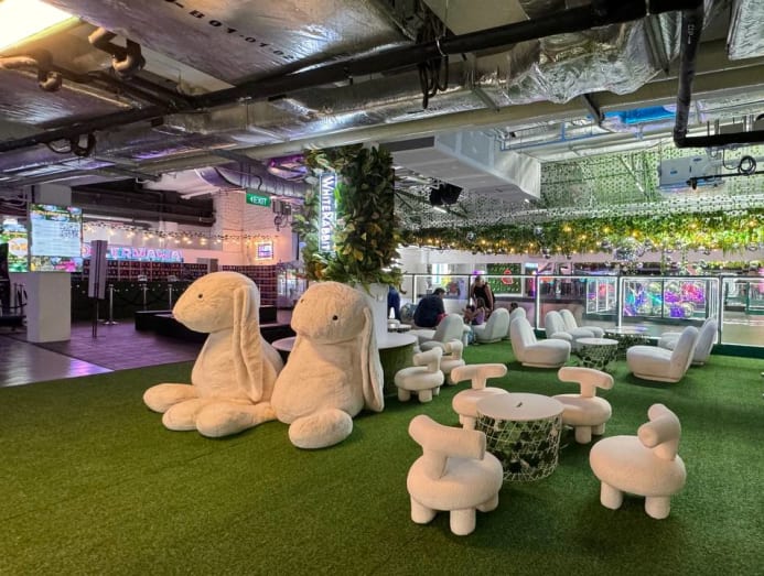 white_rabbit_cafe_seatings_with_giant_white_rabbits_display.jpg