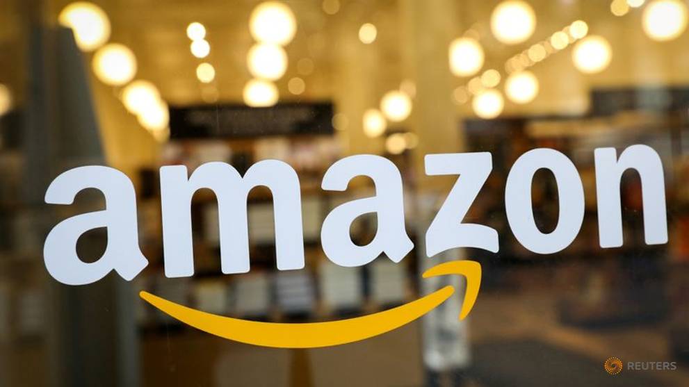 file-photo--the-logo-of-amazon-is-seen-on-the-door-of-an-amazon-books-retail-store-in-new-york-1.jpg